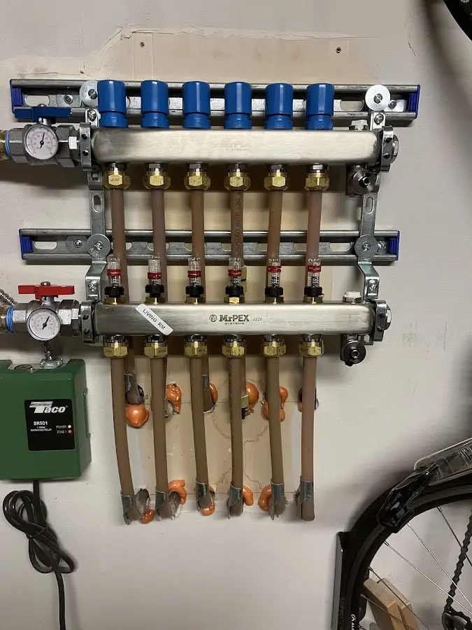 Plumber performing Water Heater Repair at a residential property in Mount Ephraim